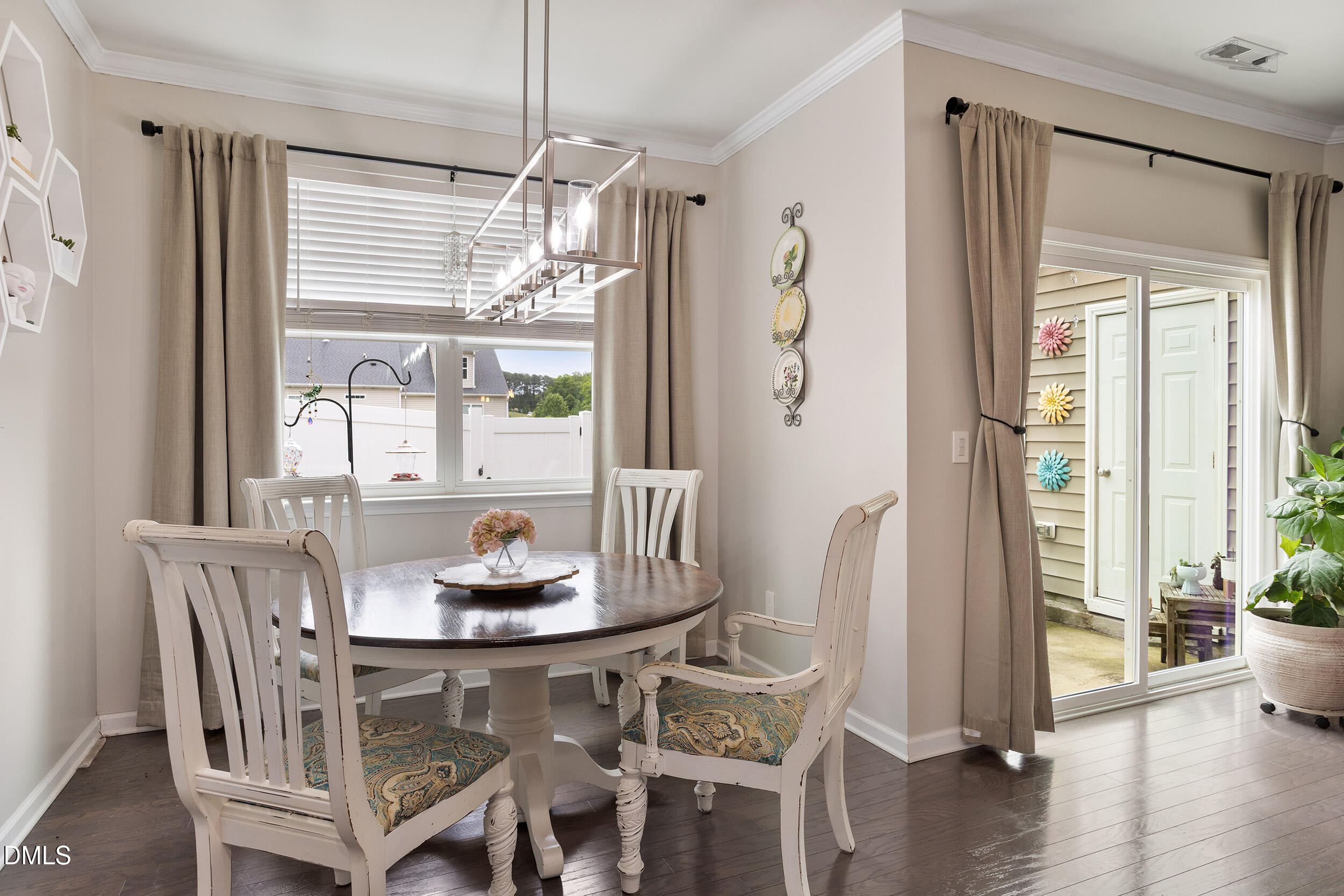 108 Zante Currant Road Durham, NC 27703 - Photo 19 of 33 a dining room with furniture window and wooden floor