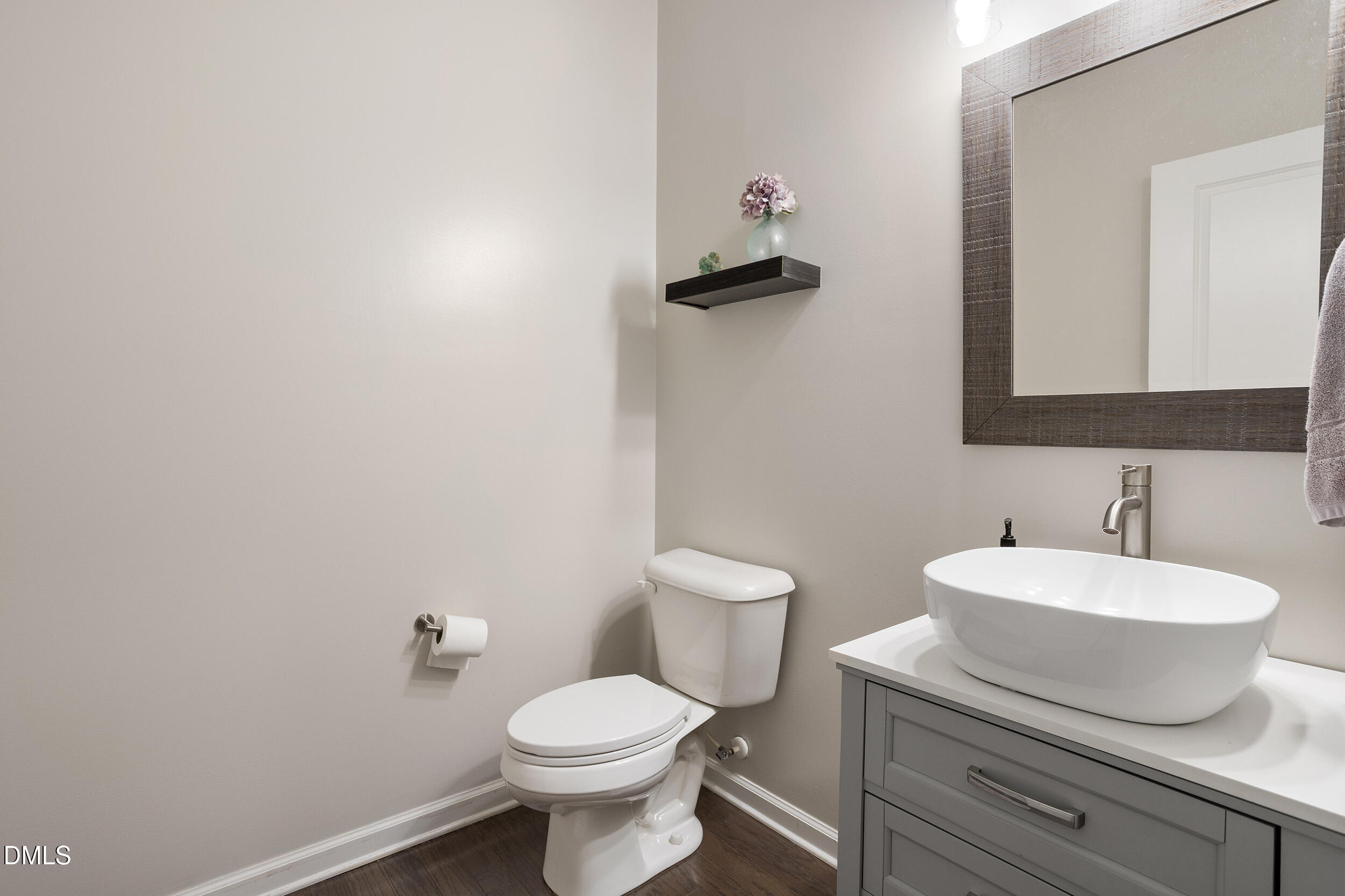 108 Zante Currant Road Durham, NC 27703 - Photo 20 of 33 a bathroom with a toilet sink and mirror