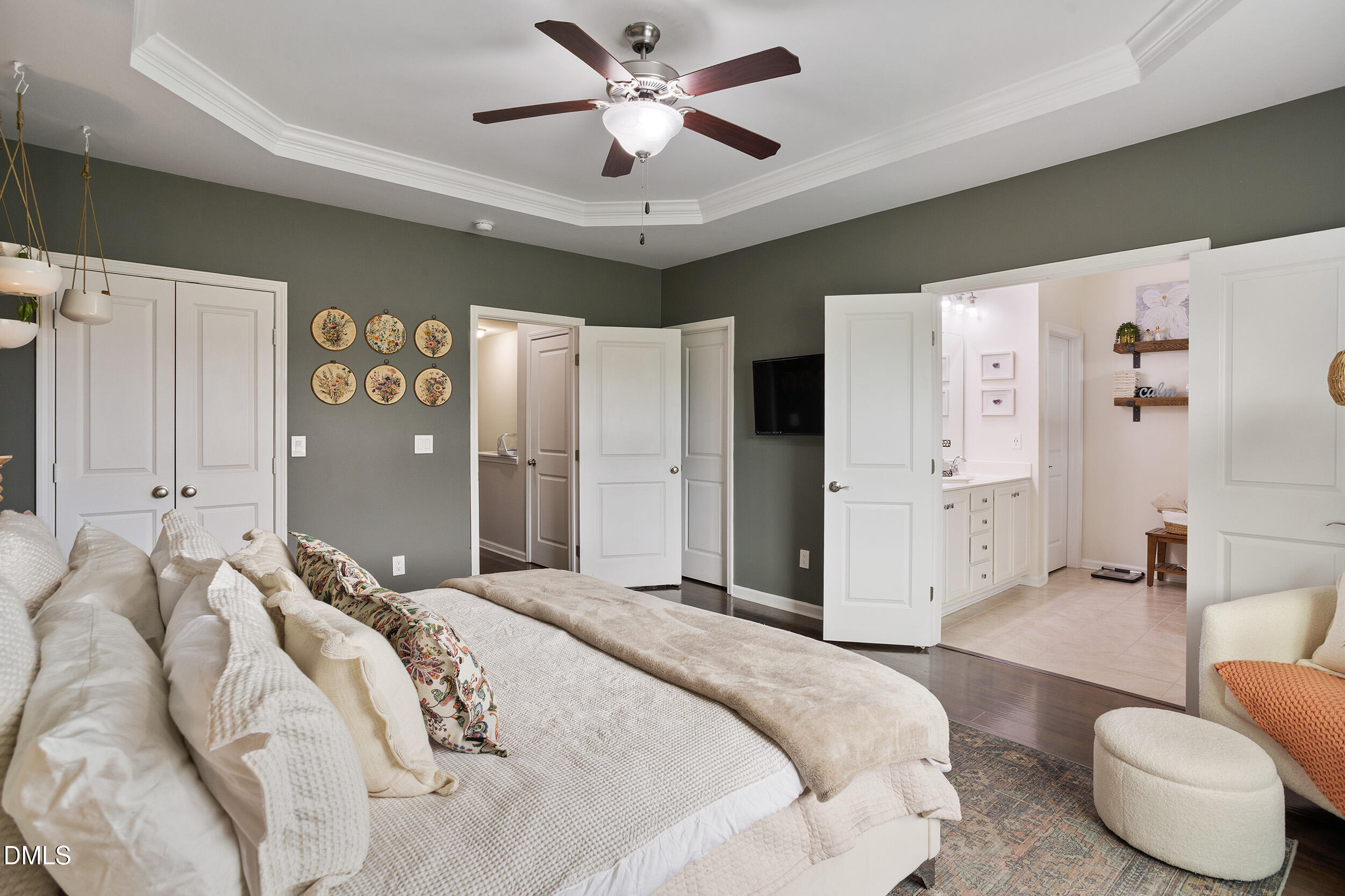 108 Zante Currant Road Durham, NC 27703 - Photo 24 of 33 a bedroom with a bed and a chandelier