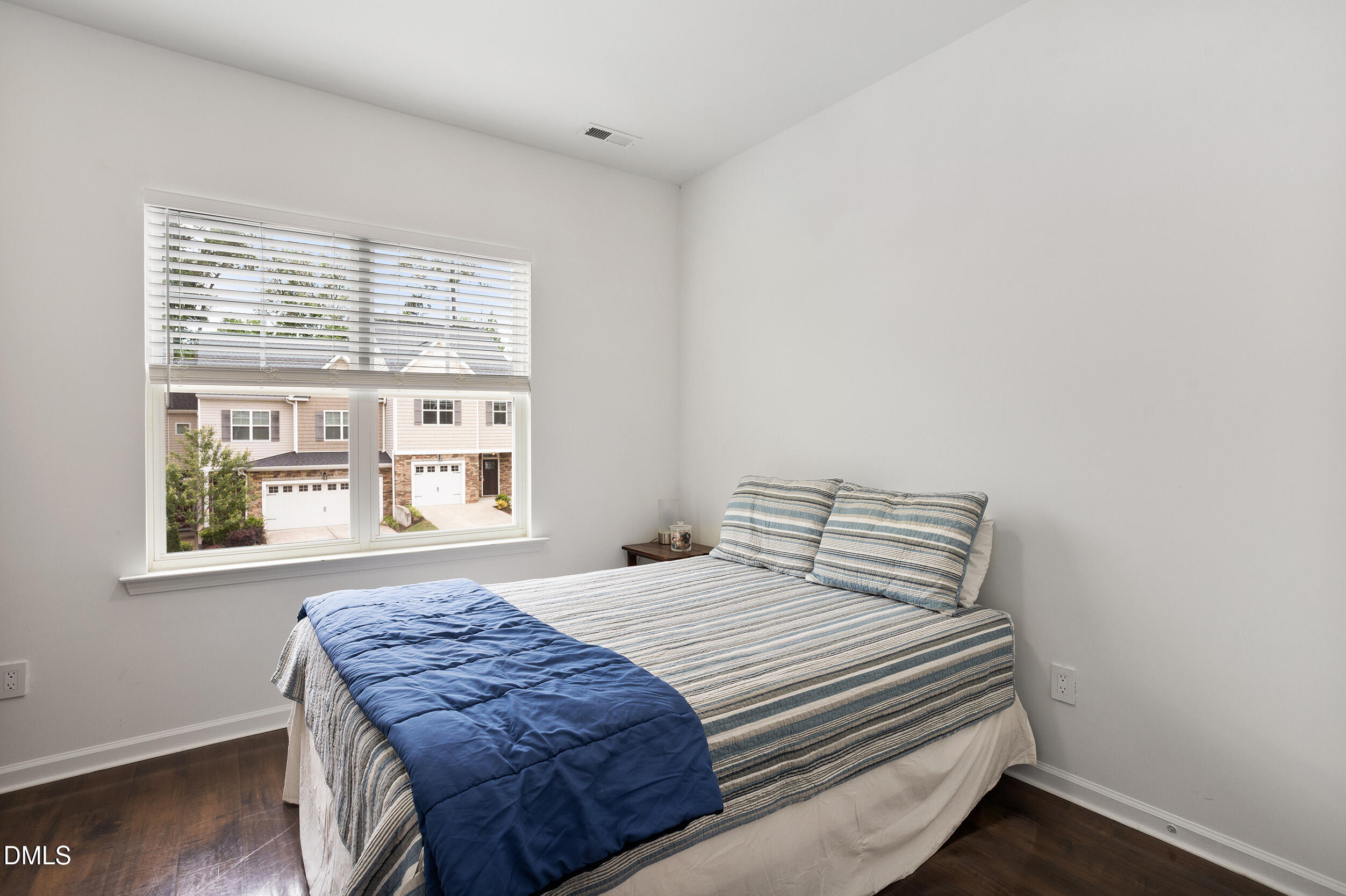 108 Zante Currant Road Durham, NC 27703 - Photo 30 of 33 a bedroom with a bed and a window