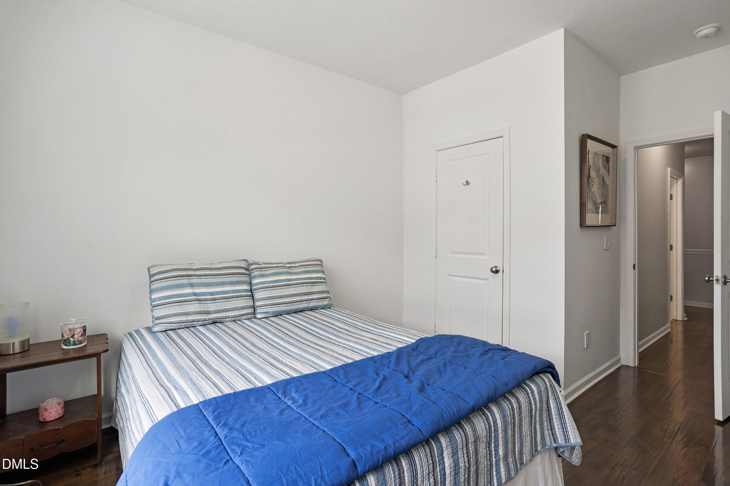 108 Zante Currant Road Durham, NC 27703 - Photo 31 of 33 a bedroom with a bed and wooden floor