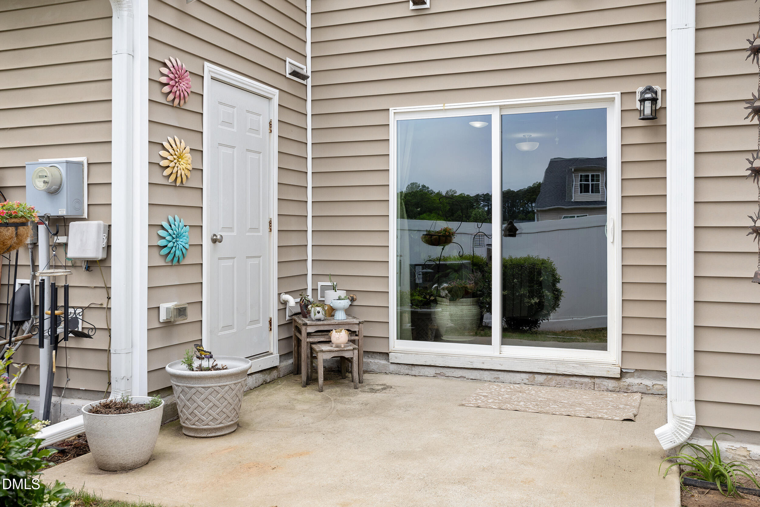 108 Zante Currant Road Durham, NC 27703 - Photo 7 of 33 a view of a balcony with chairs and potted plants