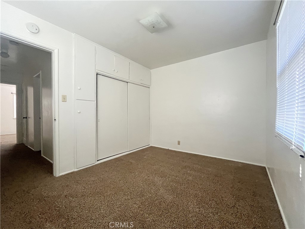 911 Park Avenue Calimesa, CA 92320 - Photo 16 of 19 an empty room with windows
