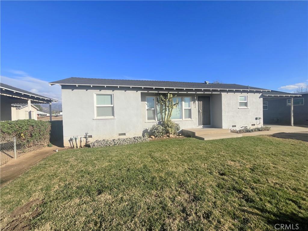 911 Park Avenue Calimesa, CA 92320 - Photo 2 of 19 a view of a house with backyard
