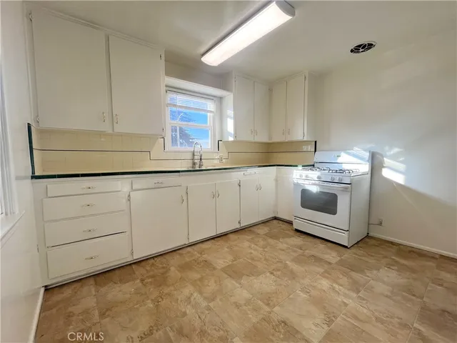 a view of a kitchen with cabinets