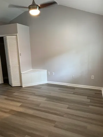 a view of a livingroom with wooden floor