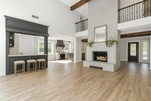 a view of a livingroom with furniture and a fireplace