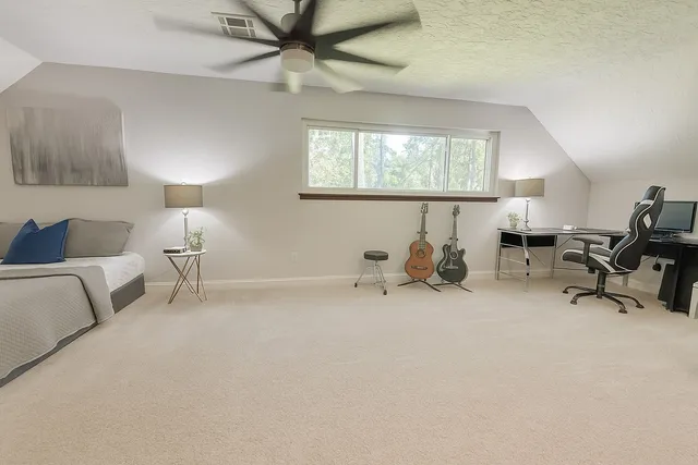 a room with a bed a table and a couch