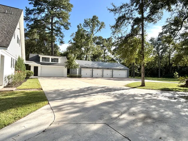 a view of a house with swimming pool and a yard