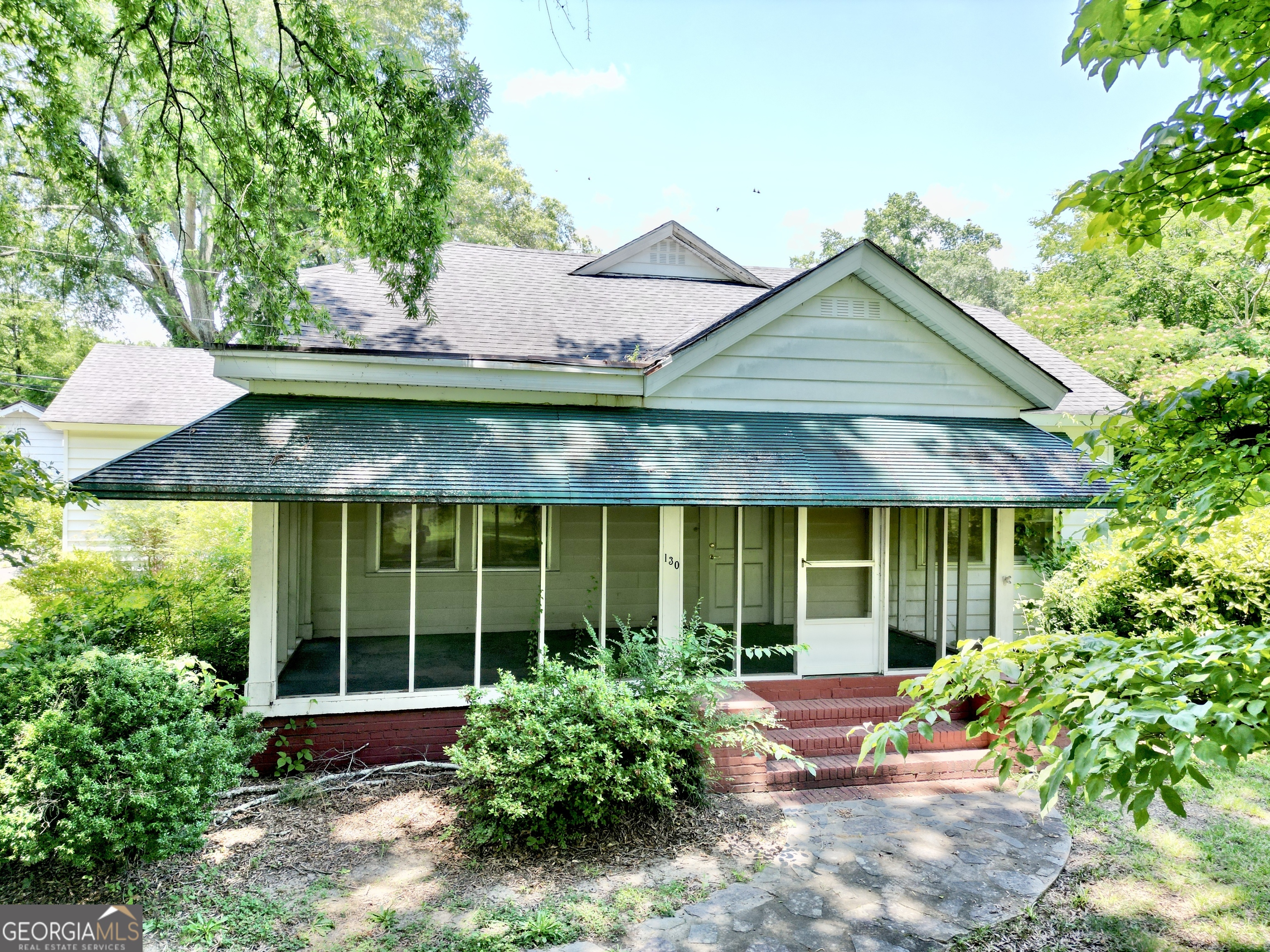 130 1st Street Northeast Rome, GA 30161 - Photo 1 of 1 a front view of a house with garden and porch