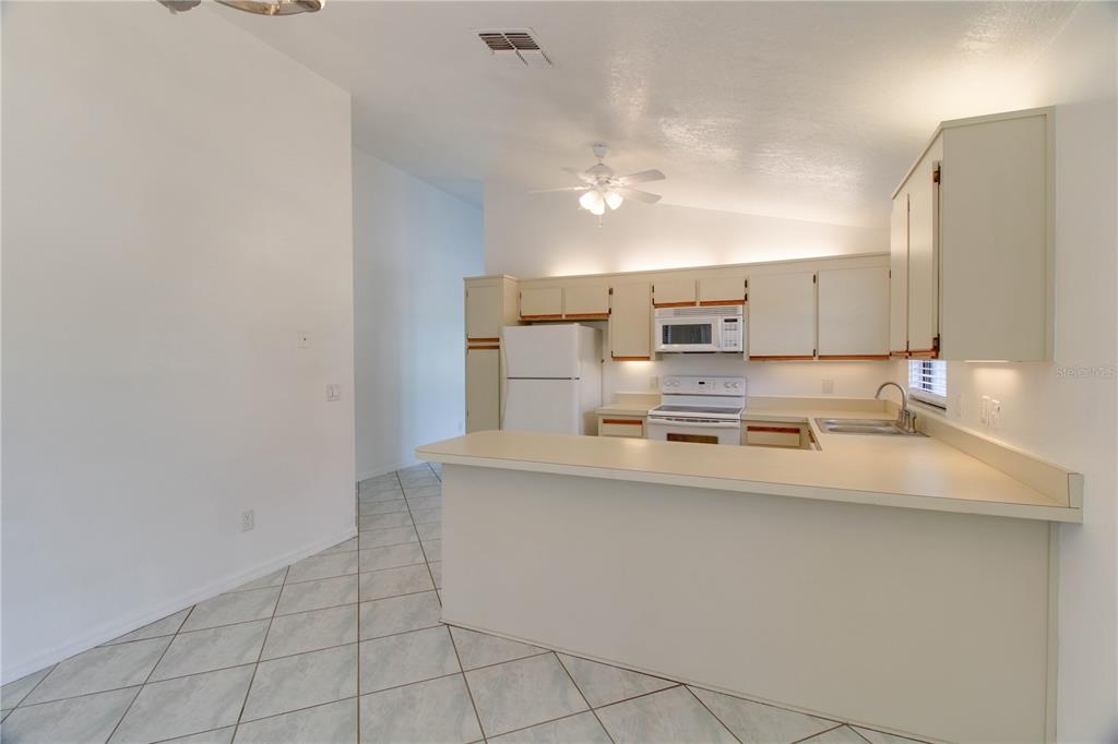3107 Ash Park Loop Winter Park, FL 32792 - Photo 4 of 11 a large kitchen with cabinets