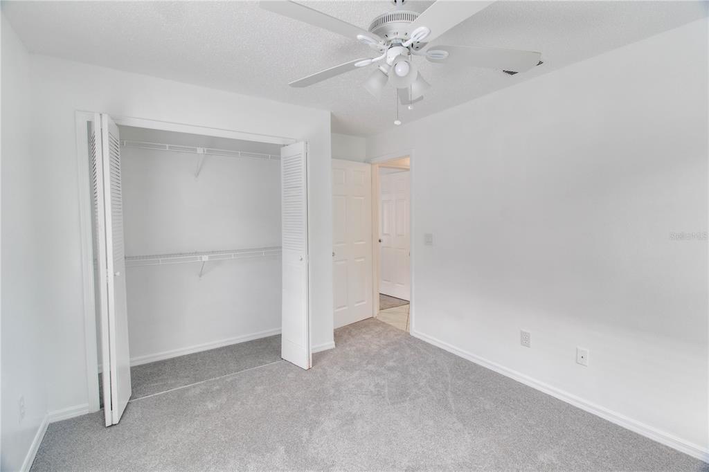 3107 Ash Park Loop Winter Park, FL 32792 - Photo 9 of 11 an empty room with a ceiling fan and a window
