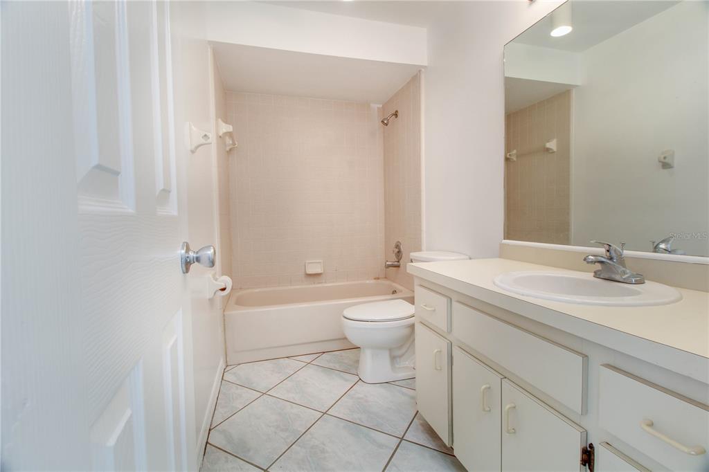 3107 Ash Park Loop Winter Park, FL 32792 - Photo 10 of 11 a bathroom with a sink a toilet and shower
