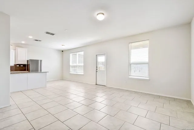 a view of an empty room and window