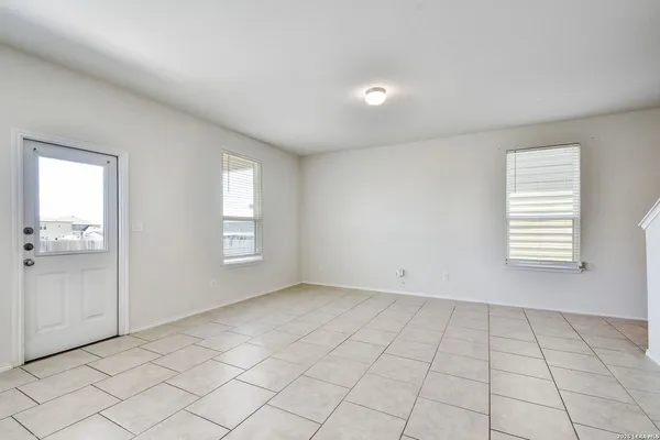 a view of an empty room and window