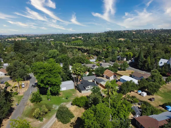 an aerial view of a house with a garden