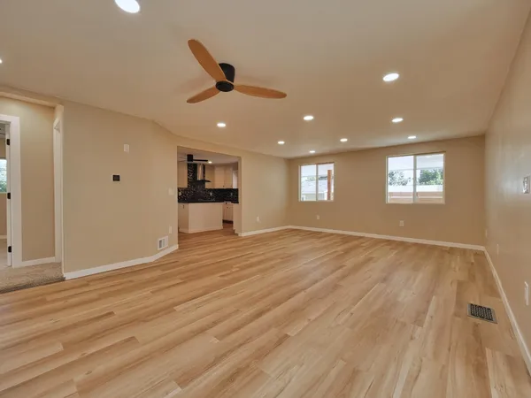 a view of an empty room with a window