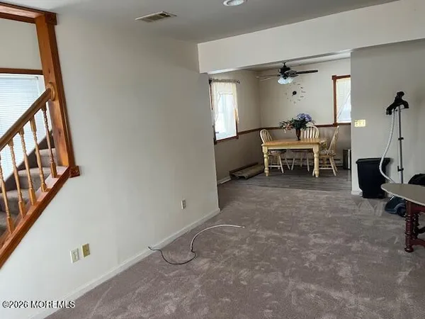 a view of a livingroom with furniture and a window