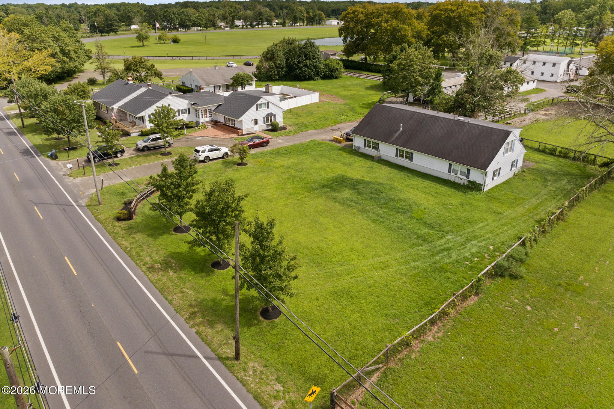 16 Archertown Road, Unit B New Egypt, NJ 08533 - Photo 7 of 7 a view of a swimming pool with lawn chairs and plants