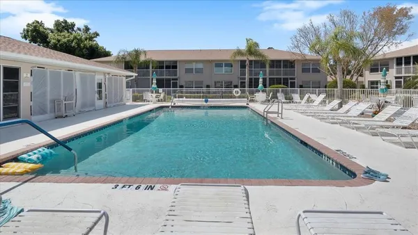 a view of a patio with swimming pool