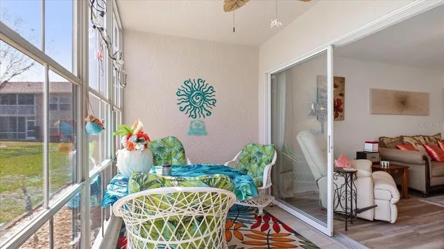 a balcony with furniture and wooden floor