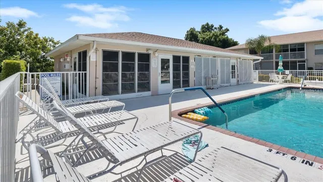 a view of a house with backyard sitting area and garden