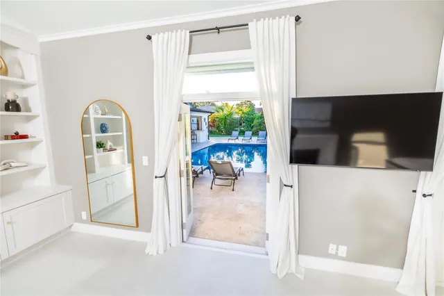 a view of living room with furniture and large window