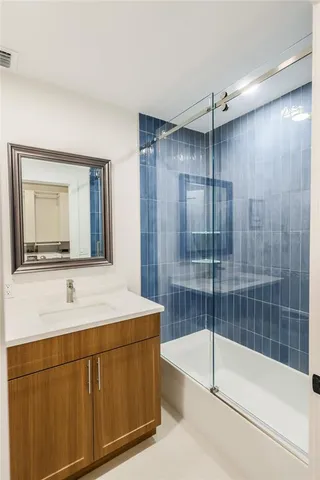 a bathroom with a bathtub and a sink