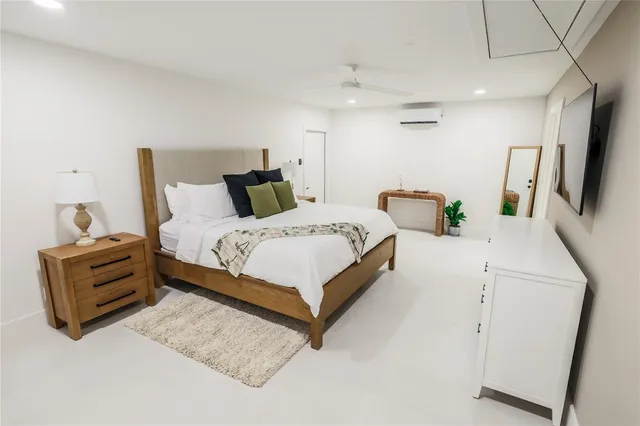 a bedroom with bed and window