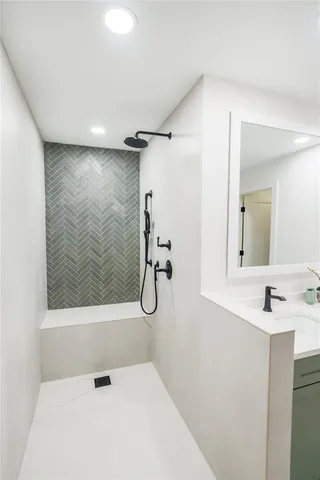 a bathroom with a shower and a mirror