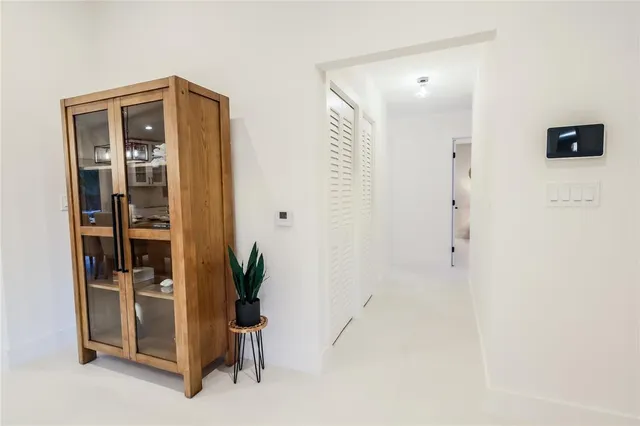 a view of an entryway with wooden floor