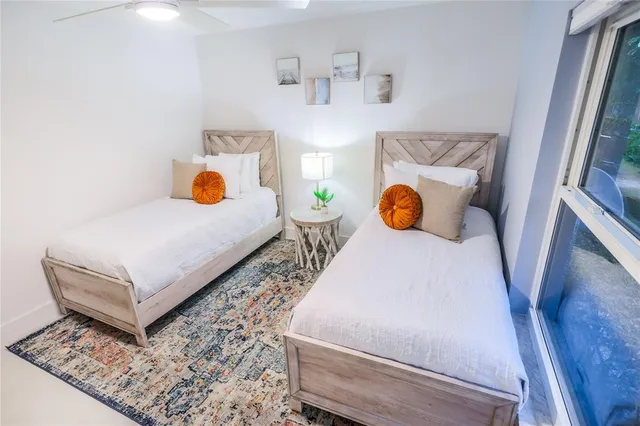 a bedroom with a bed and window