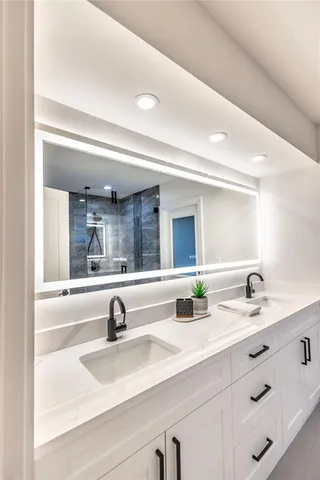 a view of double vanity sink with mirror