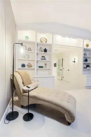 a spacious bedroom with a bed and a cabinets