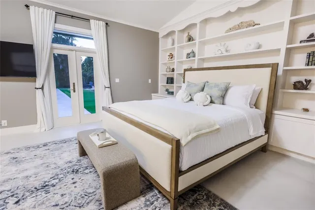 a large white bed in a white room