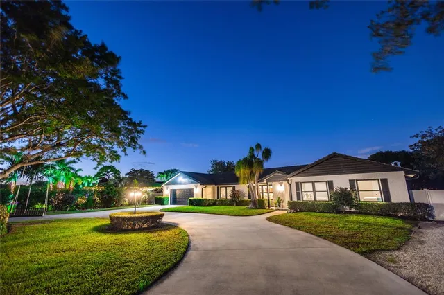 an aerial view of house with yard