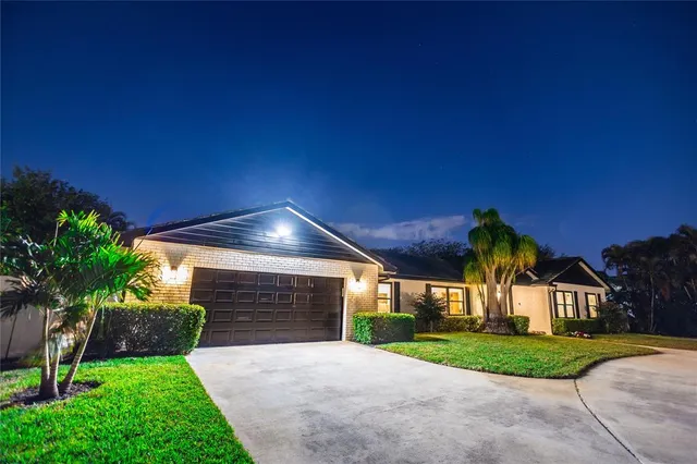 an aerial view of residential houses with outdoor space and street view