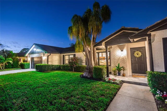 a view of a house with a yard