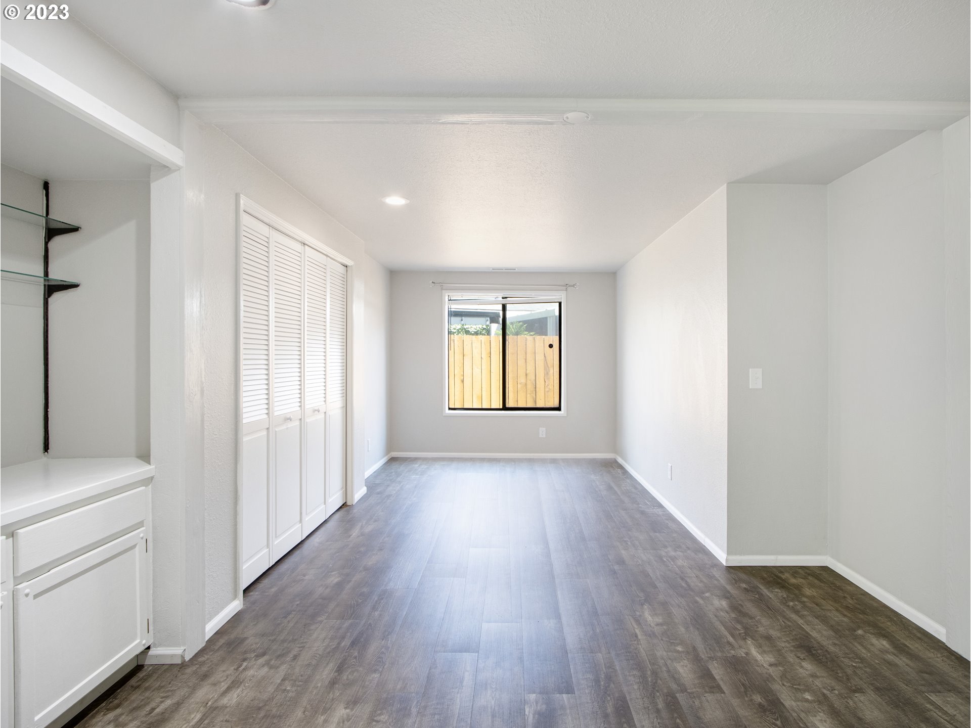 2883 Elysium Avenue Eugene, OR 97401 - Photo 13 of 21 wooden floor in an empty room with a window