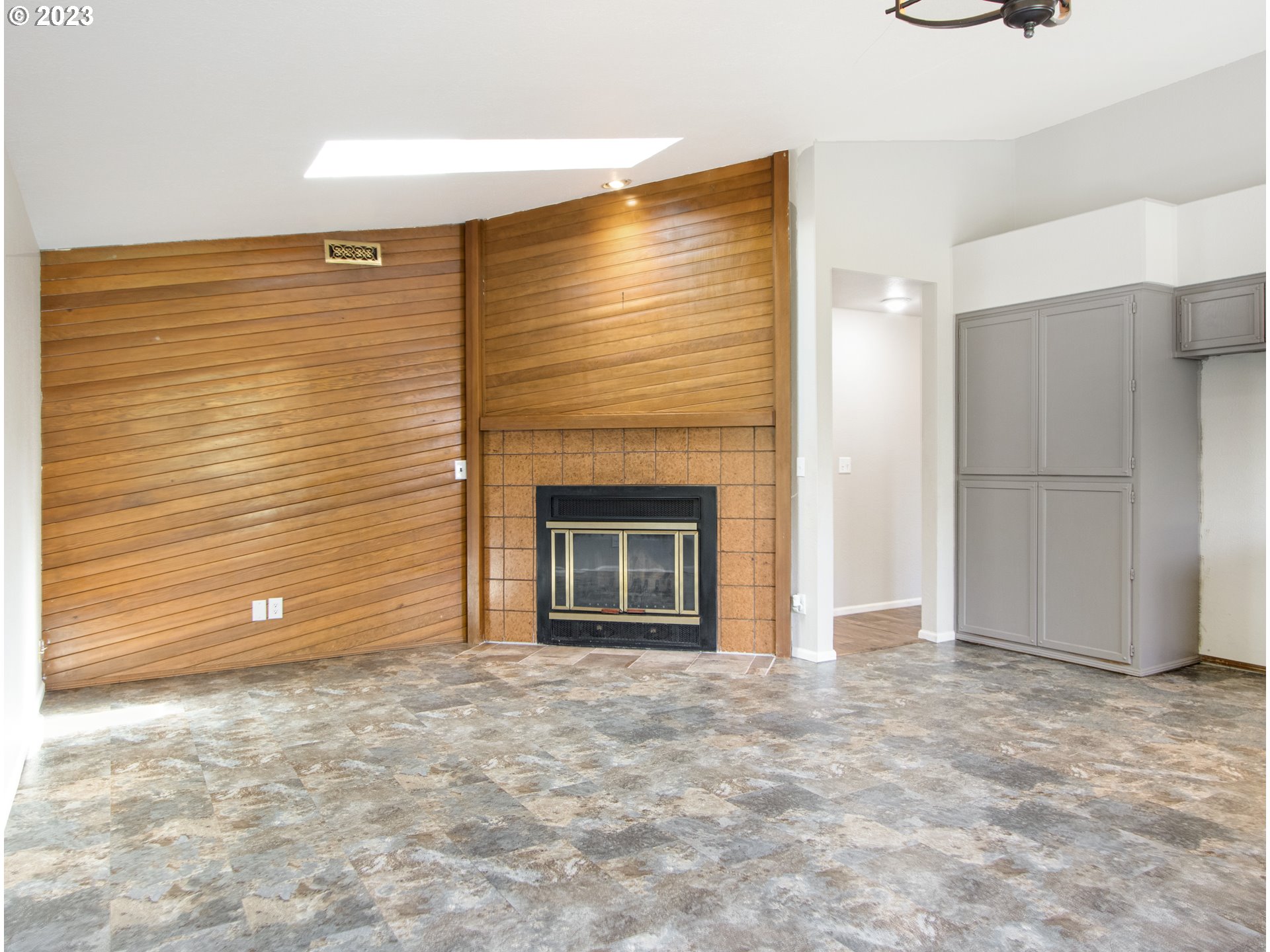 2883 Elysium Avenue Eugene, OR 97401 - Photo 6 of 21 a view of an empty room with a fireplace