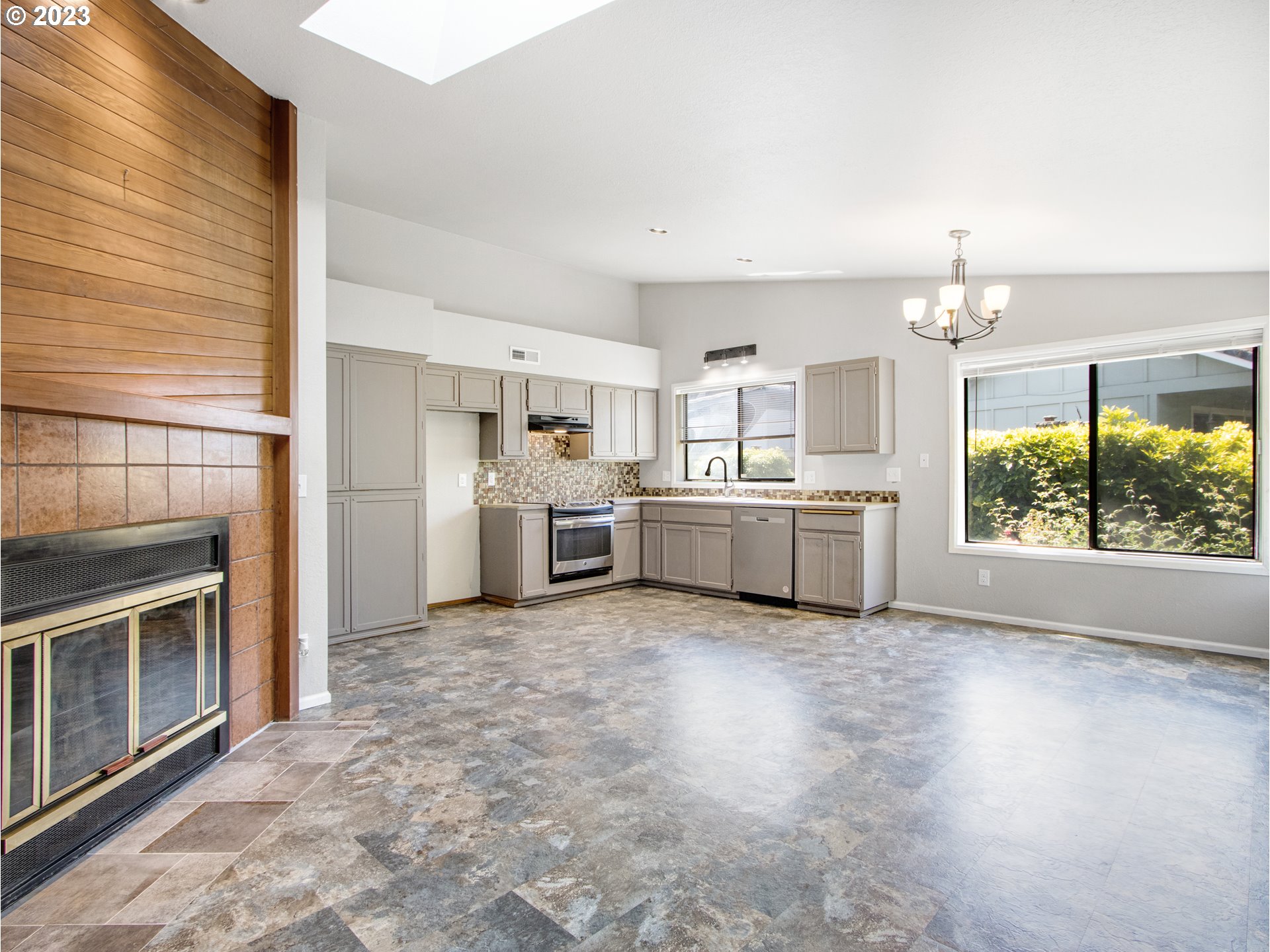 2883 Elysium Avenue Eugene, OR 97401 - Photo 7 of 21 a view of a kitchen with a sink dishwasher oven window and a kitchen