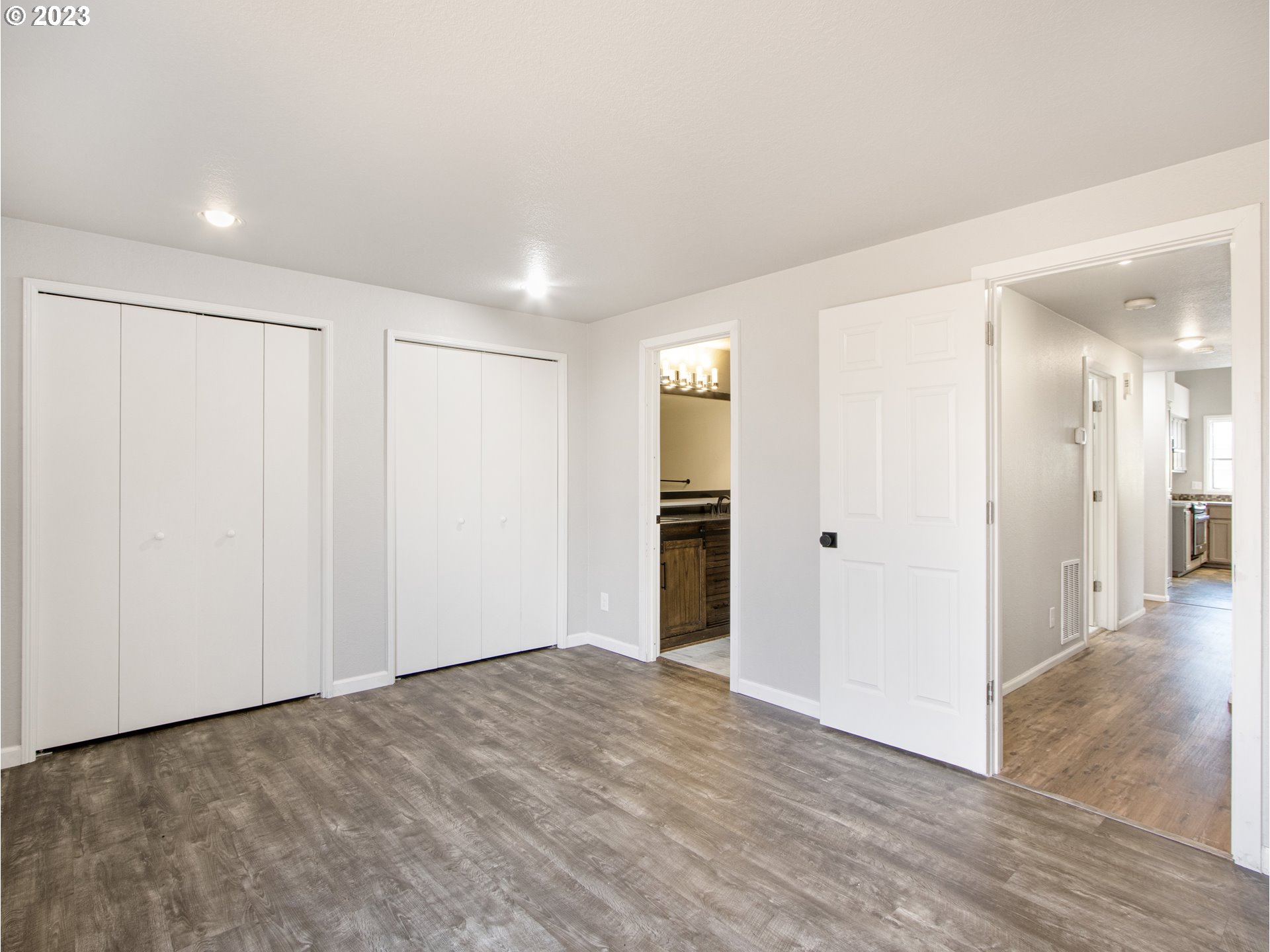 2883 Elysium Avenue Eugene, OR 97401 - Photo 10 of 21 a view of empty room with wooden floor