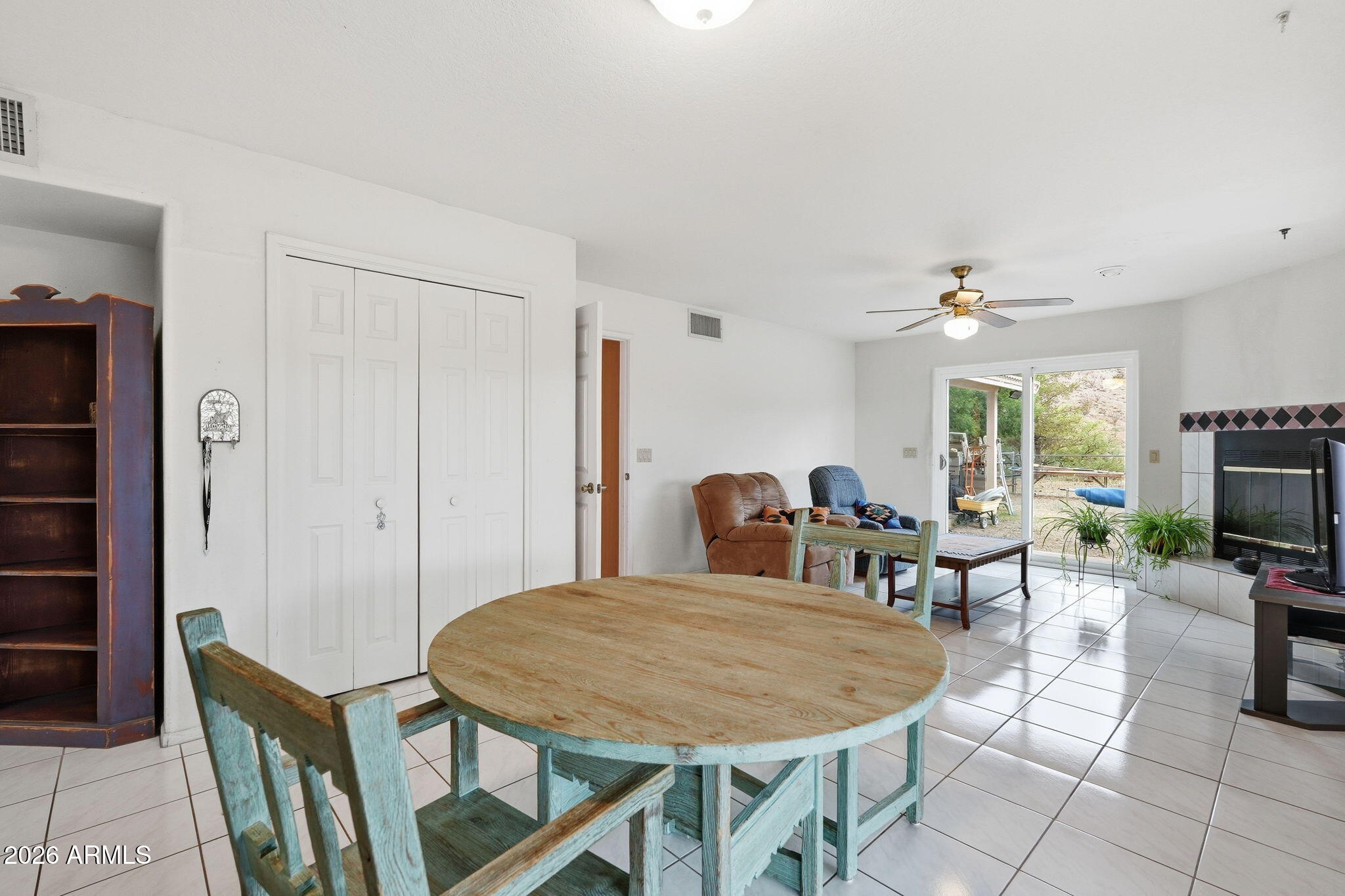428 Camino Canoa Rio Rico, AZ 85648 - Photo 11 of 56 a dining room with furniture a window and a flat screen tv
