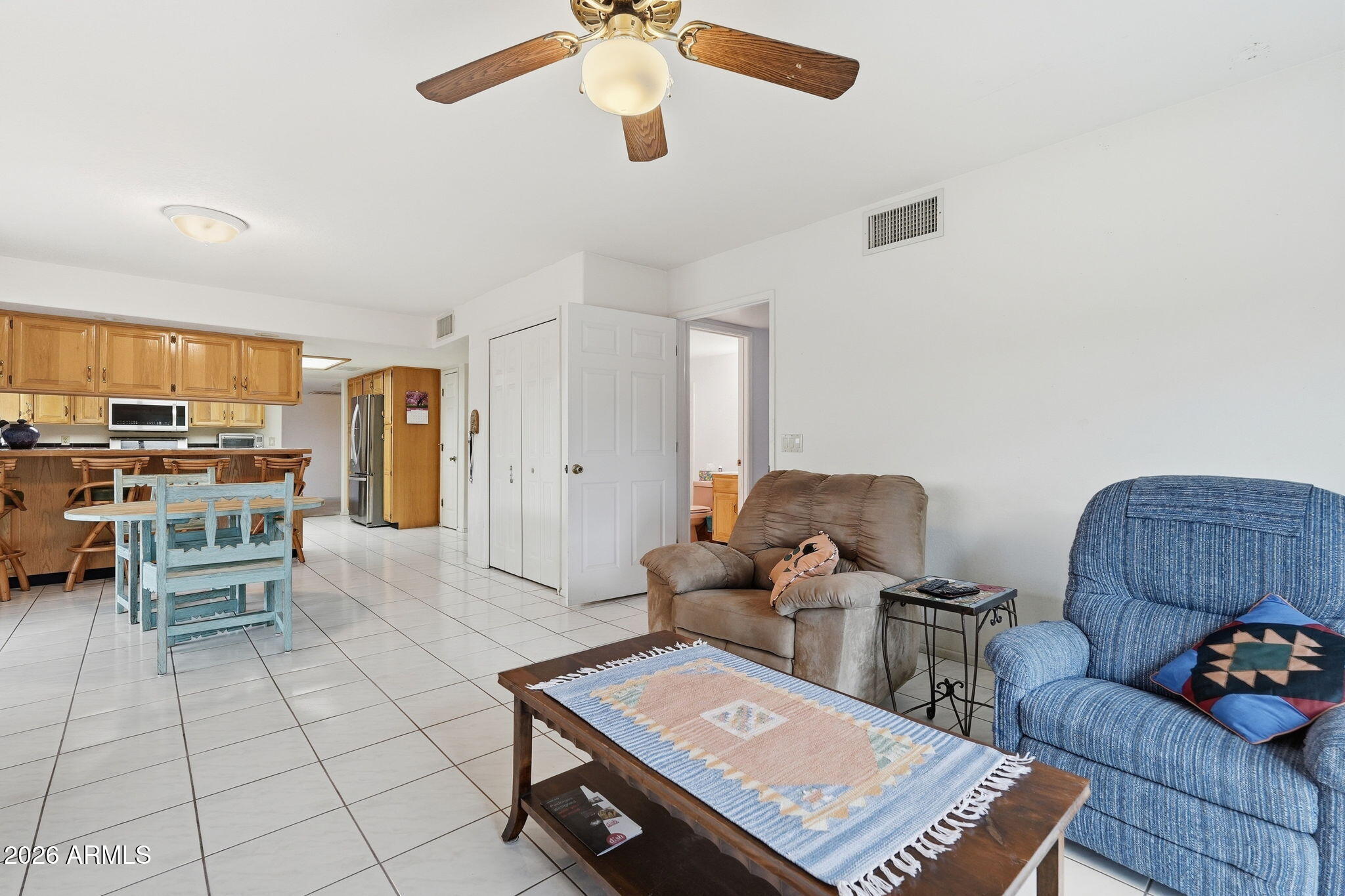 428 Camino Canoa Rio Rico, AZ 85648 - Photo 12 of 56 a living room with furniture and a book shelf