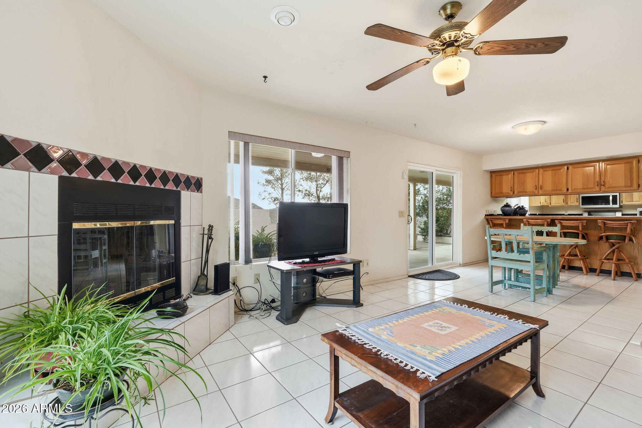 428 Camino Canoa Rio Rico, AZ 85648 - Photo 13 of 56 a living room with furniture a flat screen tv and a table