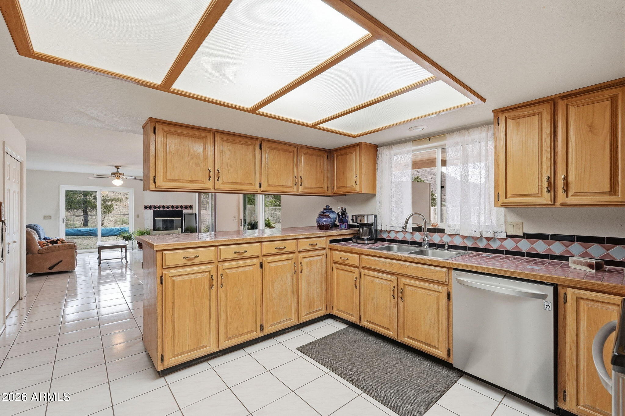 428 Camino Canoa Rio Rico, AZ 85648 - Photo 15 of 56 a kitchen with stainless steel appliances granite countertop a sink and cabinets
