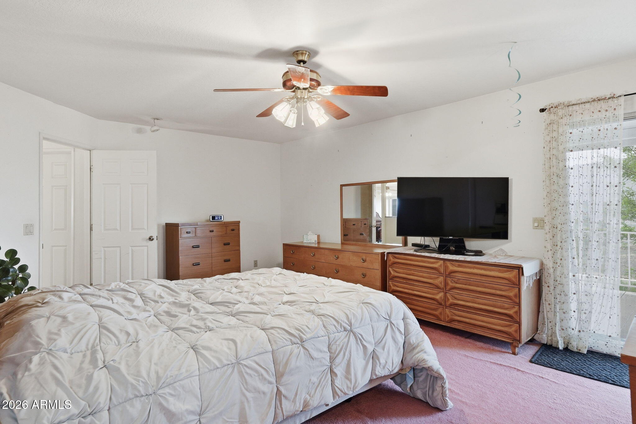 428 Camino Canoa Rio Rico, AZ 85648 - Photo 26 of 56 a bedroom with a bed and a flat screen tv