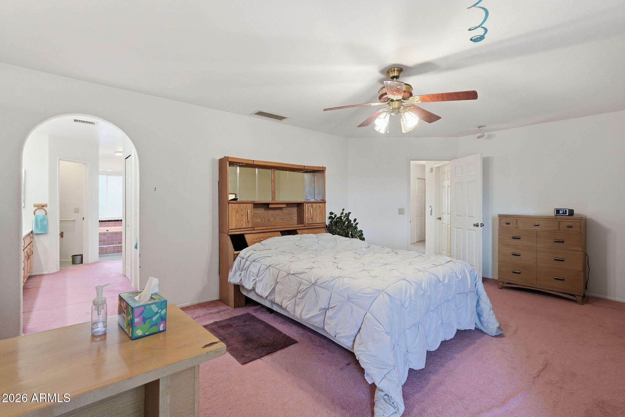 428 Camino Canoa Rio Rico, AZ 85648 - Photo 27 of 56 a spacious bedroom with a bed and a chandelier