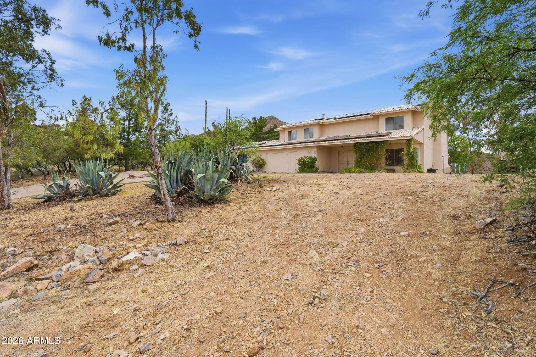 428 Camino Canoa Rio Rico, AZ 85648 - Photo 3 of 56 a front view of a house with a yard