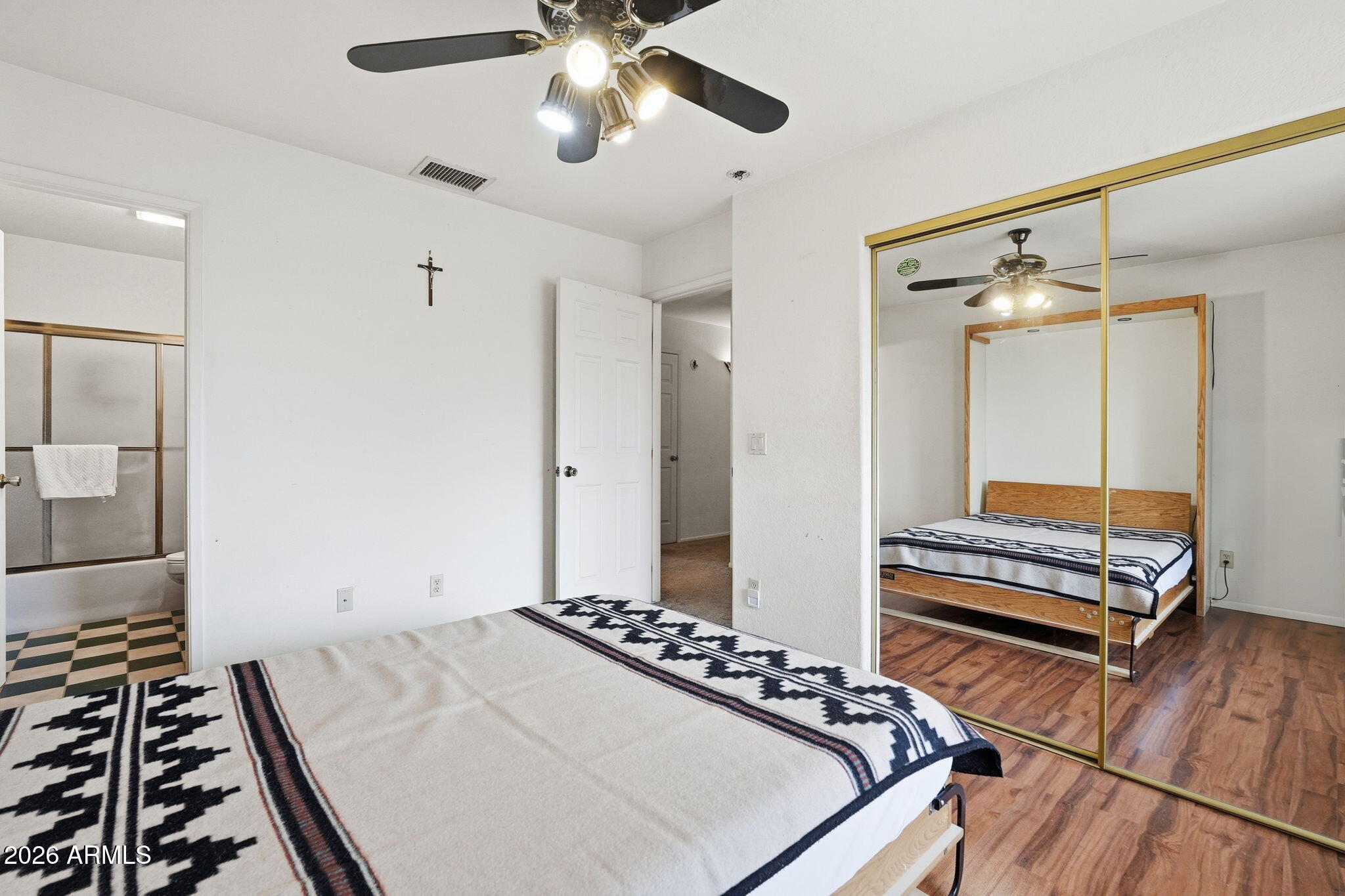 428 Camino Canoa Rio Rico, AZ 85648 - Photo 34 of 56 a bedroom with a bed and a chandelier